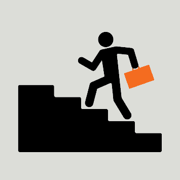 Person with brief case walking up stairs